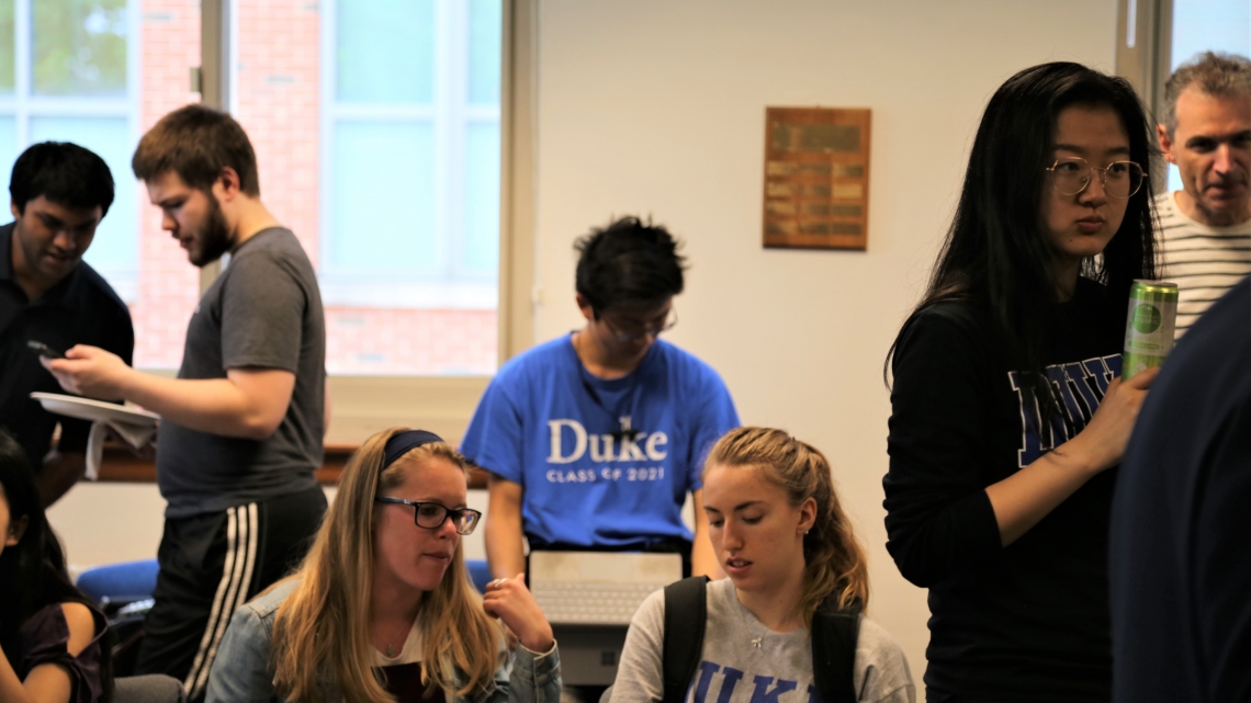 Faculty, graduate and undergraduate students in the math lounge