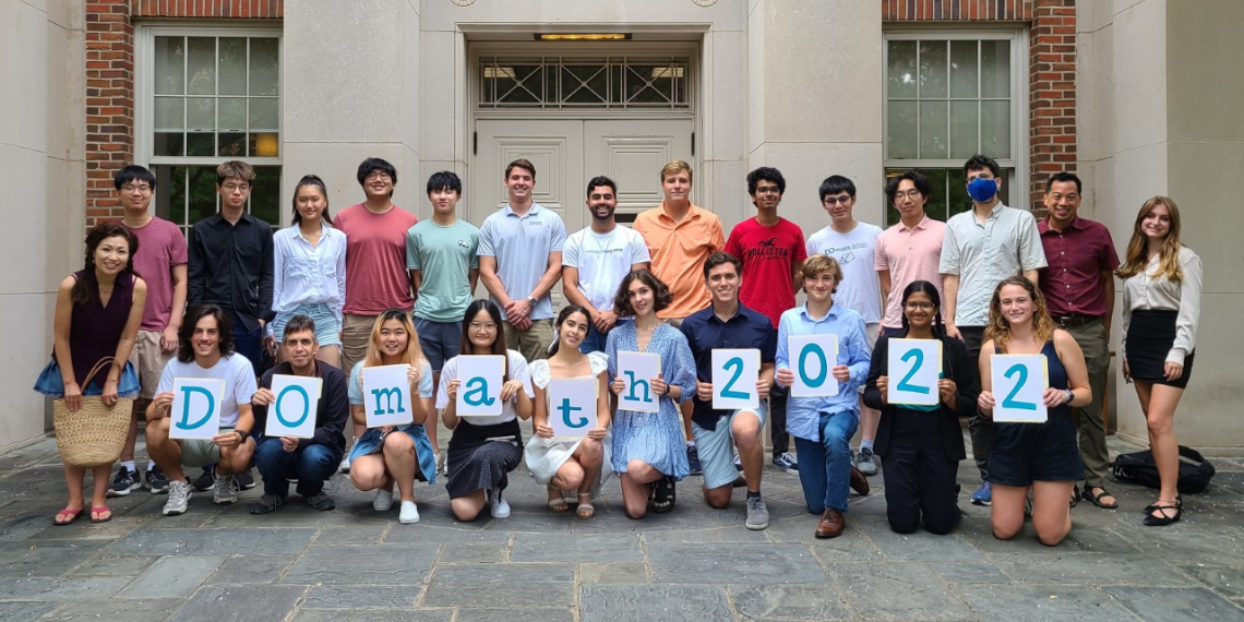 DOMath students holding DOMath 2022 signs