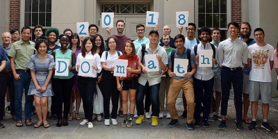 students holding DOmath 2018 sign